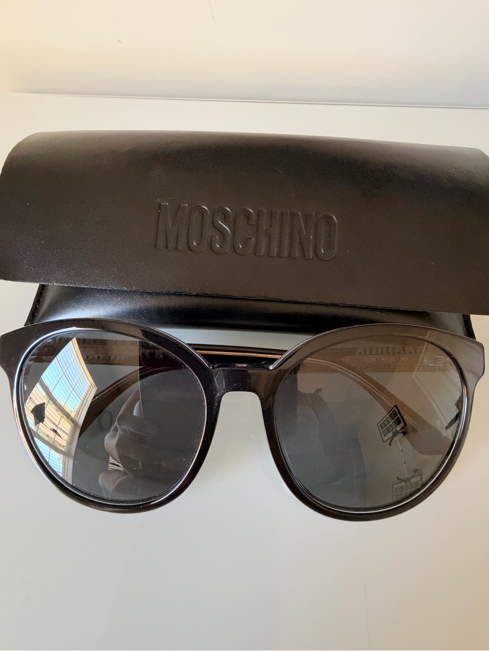 Moschino women’s sunglasses with case.